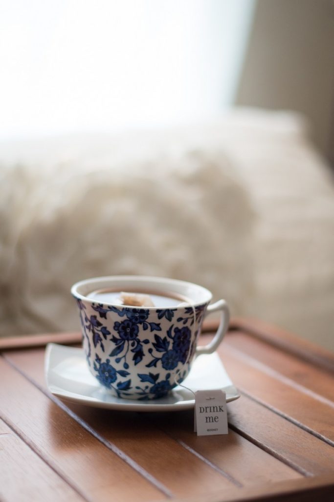 Blue and white teacup with tea waiting calmly for drinker.